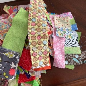 Scrap fabric - 2.5 inch squares strips and pieces larger than 3 inches